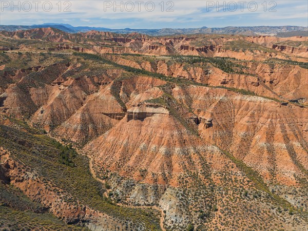 Impressive red rocks and canyons in a hilly desert landscape under a clear sky, aerial view, Los Coloraos, Grand Canyon of Andalusia, Gorafe Desert, Granada, Andalusia, Spain, Europe