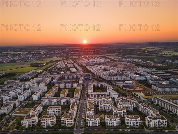 The sun rises over the Riedberg district of Frankfurt. (Aerial view with a drone), Riedberg, Frankfurt am Main, Hesse, Germany, Europe