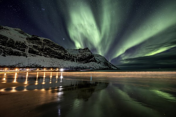 Green northern lights, aurora borealis, reflected in the sea, beach, coast, Senja, Troms, Norway, Europe