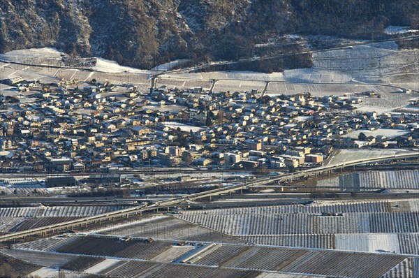 The municipality of Riddes in the Rhone Valley surrounded by vineyards in winter, Riddes, Valais, Switzerland, Europe