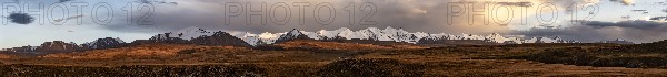 Panorama, Glaciated and snow-capped mountains, dramatic mountain landscape at sunset, autumnal plateau with yellow grass, Tian Shan, Sky Mountains, Sary Jaz Valley, Kyrgyzstan, Asia
