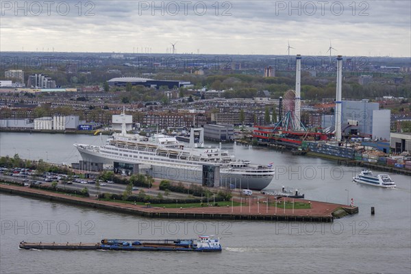 Harbour view with a large cruise ship, water surfaces and industrial facilities under a cloudy sky, view from above of a modern city with skyscrapers, bridges and a harbour, Rotterdam, Netherlands