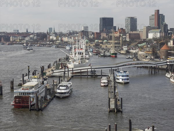Close-up of a harbour with boats and city buildings in the background, many ships in a harbour with a beautiful promenade, HAmburg, Germany, Europe