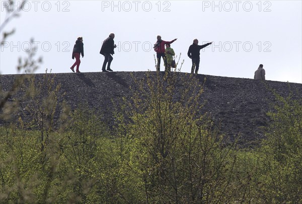 Walkers cross the Rungenberg slag heap in Gelsenkirchen, Gelsenkirchen, North Rhine-Westphalia, Germany on 12 April 2015