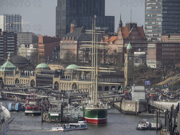Close-up of a harbour with a sailing ship and historical next to modern buildings, many ships in a harbour with a beautiful promenade, HAmburg, Germany, Europe