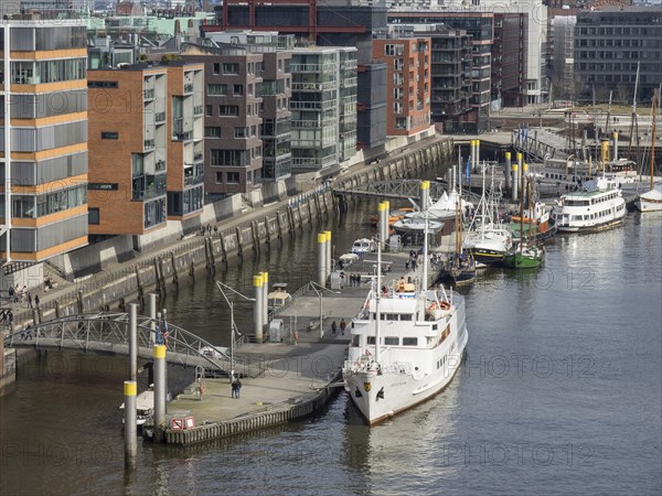 Close-up of boats in the harbour with modern city buildings in the background, many ships in a harbour with a beautiful promenade, HAmburg, Germany, Europe