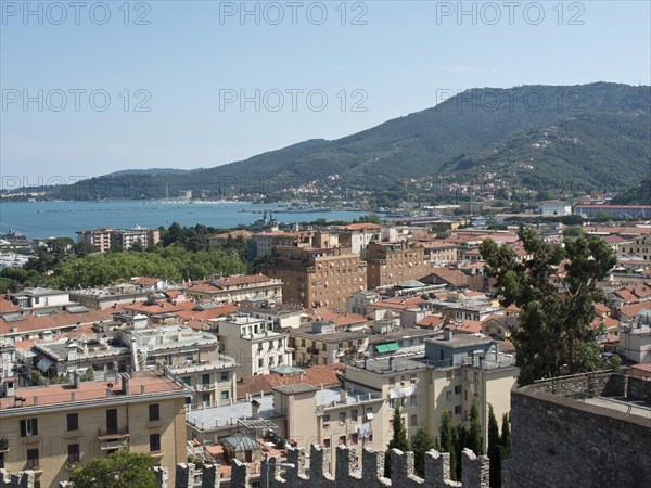 View of a city with red roofs, surrounded by mountains and sea under a clear sky, Bari, Italy, Europe