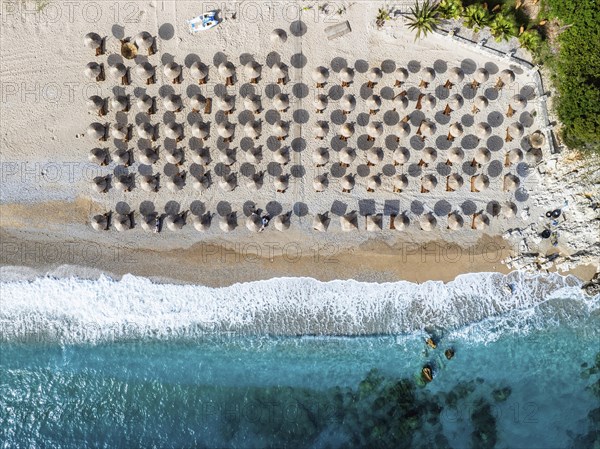 Top Down over Umbrellas and Beach in Himare from a drone, Albanian Riviera, Albania, Europe