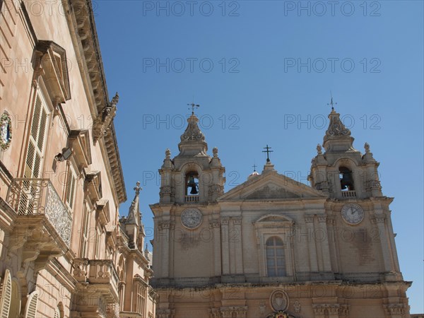 Baroque church with two bell towers in the bright blue sky, the town of mdina on the island of malta with historic houses, colourful balconies, magnificent churches, mdina, Malta, Europe