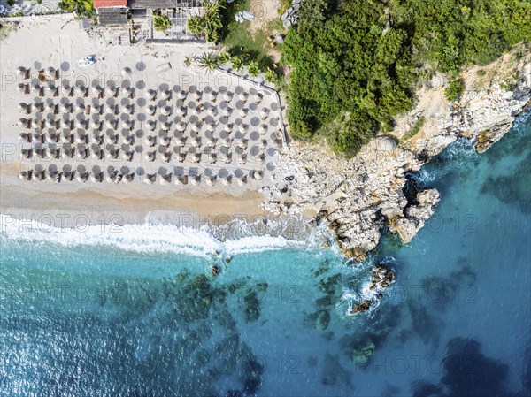 Top Down over Umbrellas and Beach in Himare from a drone, Albanian Riviera, Albania, Europe