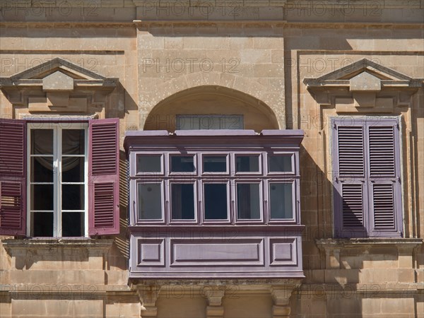 Historic building with purple shutters and balconies, the town of mdina on the island of malta with historic houses, colourful balconies, magnificent churches, mdina, Malta, Europe