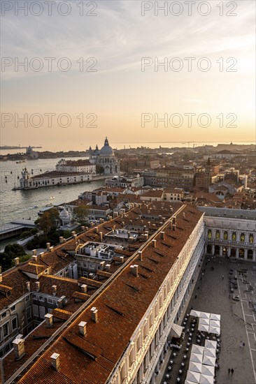 St Mark's Square and Basilica di Santa Maria della Salute on the Grand Canal at sunset, view from the Campanile di San Marco bell tower, city view of Venice, Veneto, Italy, Europe