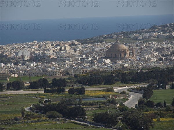 Panoramic view of a town near the sea with a striking dome and mediterranean buildings, the town of mdina on the island of malta with historic houses, colourful balconies, magnificent churches, mdina, Malta, Europe