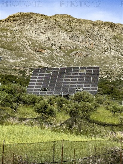 Large thermal solar system Solar collectors align themselves with the position of the sun Sun rays, Crete, Greece, Europe