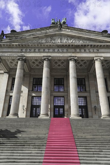 The concert hall am Gendarmenmarkt in Berlin, Germany, Europe, Entrance of a large building with high columns and stairs with red carpet, Berlin, Europe