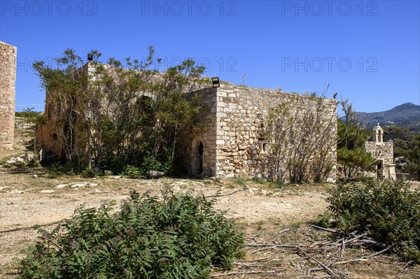 Ruin of former house of bishop from Venetian period in front of Ottoman occupation Occupation of Ottoman Empire in historical fortress Fortetza Fortezza of Rethymno built by Republic of Venice in 16th century in northwest of old town of Rethymno on rocky hill Paleokastro on north coast of island Crete, Rethymno, Crete, Greece, Europe