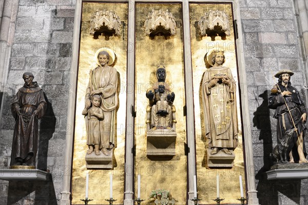 Basilica of Santa Maria del Pi in Barcelona, Catalonia, Spain, architecture in the Catalan Gothic style from the 14th century, Europe, relief with figures of saints and gold-coloured background in a church, Barcelona, Europe