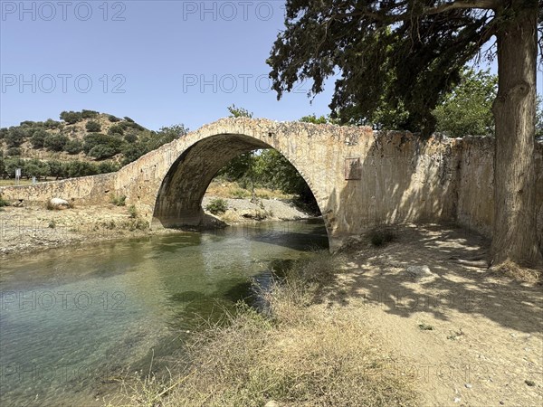 Historic classical stone arch bridge in Venetian architectural style Venetian Great Old Bridge 19th century stone bridge built in 1850 in Ottoman times over the middle reaches of the Megalopotamos River at Preveli, Agios Vasilios, Crete, Greece, Europe