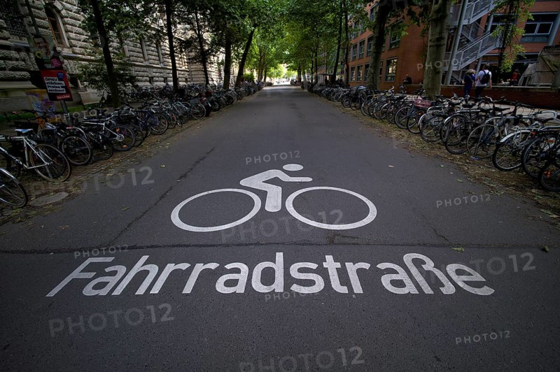 Bicycle lane, logo on asphalt, bicycles, parked, Leipzig, Saxony ...