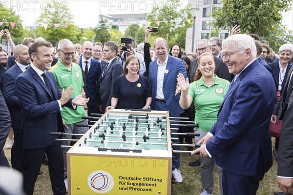Emmanuel Macron (President of the French Republic) and Frank-Walter Steinmeier (President of the Federal Republic of Germany) play table football during a tour of the Citizens' Festival celebrating democracy. / The Basic Law turns 75, together it will be a celebration, Berlin, 26.05.2024