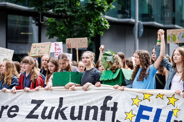 Demonstrators with signs at Fridays for Future, taken during the climate strike for the EU elections in Berlin, 31/05/2024