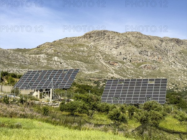 Large thermal solar system Solar collectors align themselves with the position of the sun Sun rays, Crete, Greece, Europe