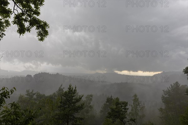 View from the goat's back in Saxon Switzerland during a thunderstorm, cloudburst, Hohnstein, Saxony, Germany, Europe