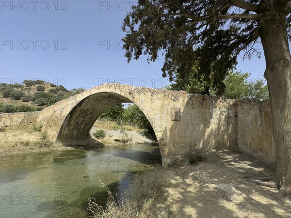 Historic classical stone arch bridge in Venetian architectural style Venetian Great Old Bridge 19th century stone bridge built in 1850 in Ottoman times over the middle reaches of the Megalopotamos River at Preveli, Agios Vasilios, Crete, Greece, Europe