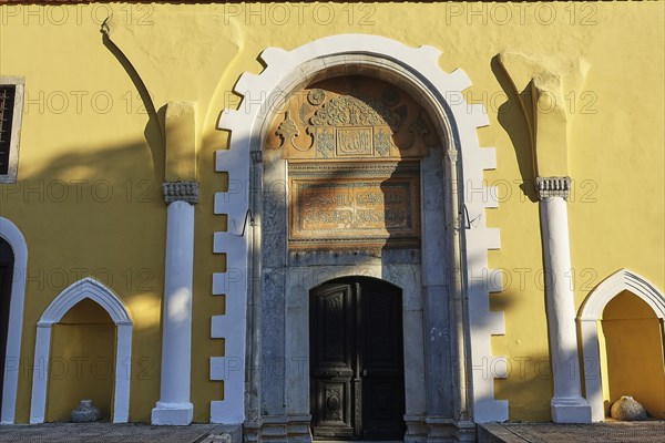 Ottoman Library, Yellow building with a large arch above the entrance door, richly decorated with inscriptions and architectural details, Rhodes Old Town, Rhodes Town, Rhodes, Dodecanese, Greek Islands, Greece, Europe