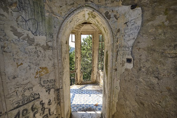 Ruin with arched windows and walls full of doodles and views of nature, Mussolini Villa, Villa de Vecchi, Profitis Ilias, Empona, Rhodes, Dodecanese, Greek Islands, Greece, Europe
