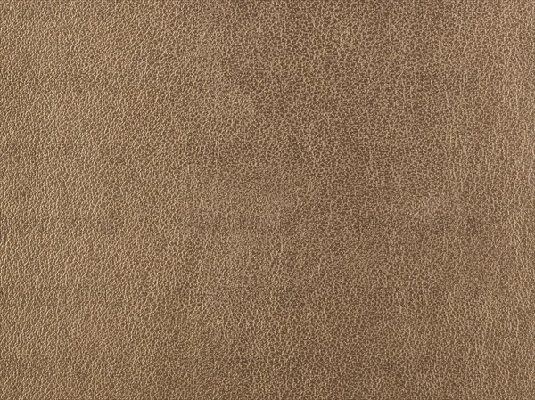 Abstract texture of synthetic leather, brown background