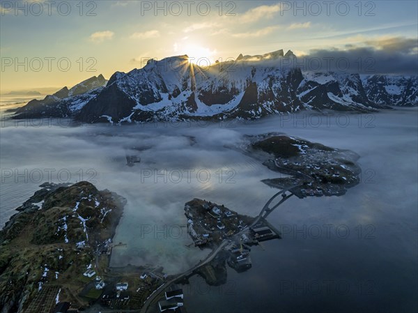 Aerial view, bridge, village, steep mountains, coast, winter, fog, evening light, Reine, Moskenesoya, Lofoten, Norway, Europe