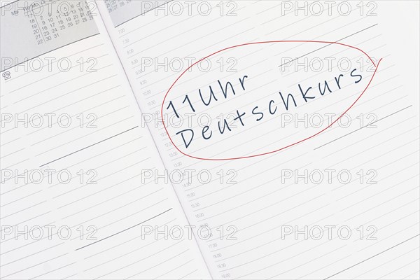 The words german course at 11 o´clock are standing in the german language in the calendar, education and integration concept