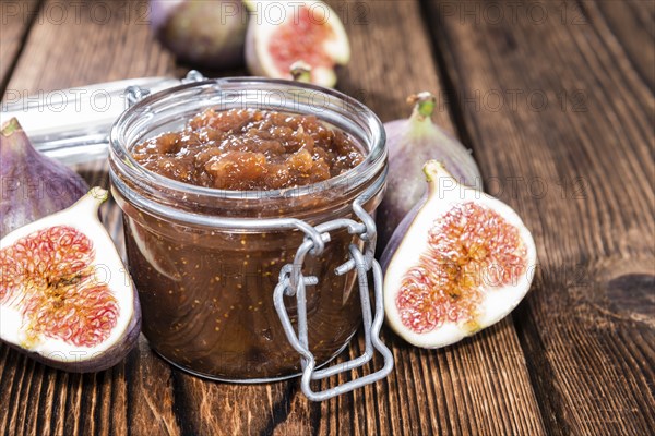 Fig Marmalade in a glass (detailed close-up shot)