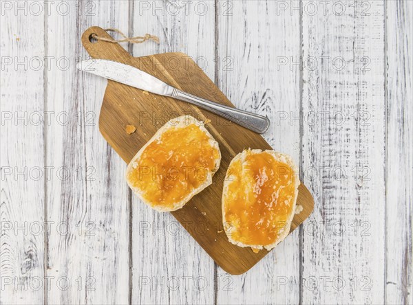 Peach Jam on a vintage background as detailed close-up shot, selective focus