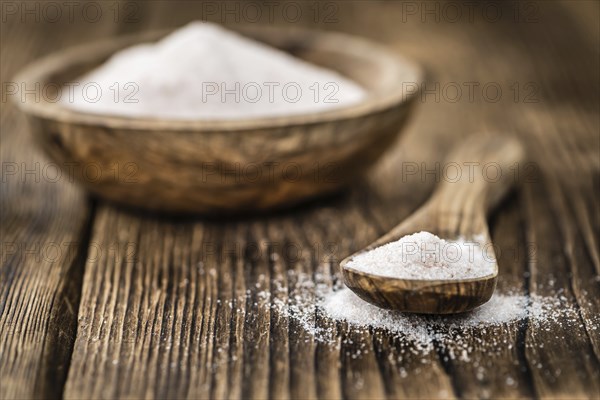 Pink Salt on a vintage background as detailed close-up shot (selective focus)