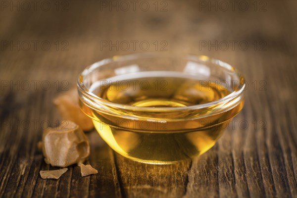 Portion of fresh Caramel Sirup (close-up shot, selective focus)