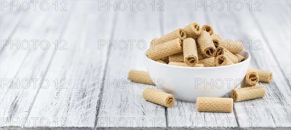 Wafers on an old wooden table as detailed close-up shot, selective focus