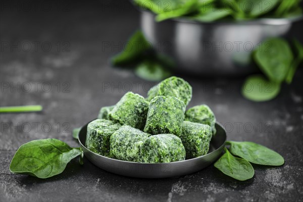 Frozen spinach cubes as detailed close up shot (selective focus)
