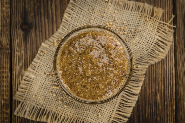 Sweet Mustard on a vintage background as detailed close-up shot (selective focus)