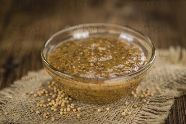Sweet Mustard on a vintage background as detailed close-up shot (selective focus)
