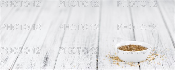 Sweet Mustard on a vintage background as detailed close-up shot (selective focus)