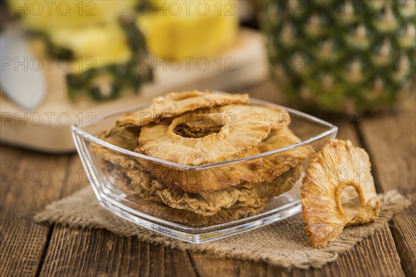 Some homemade Dried Pineapple Rings as detailed close-up shot, selective focus