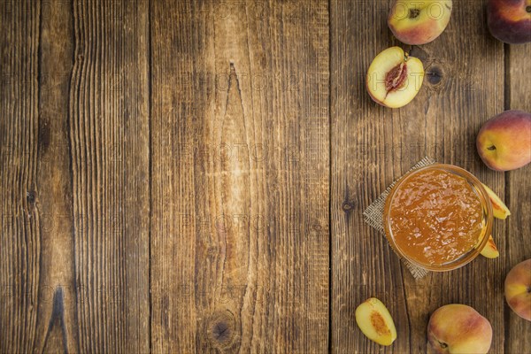 Portion of fresh Peach Jam close-up shot, selective focus