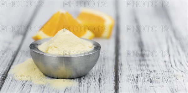 Fresh made Orange fruit Powder as detailed close-up shot (selective focus)