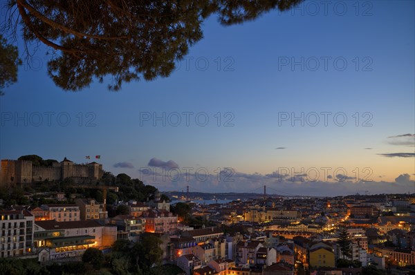 View from the viewpoint Miradouro da Graça, also Sophia de Mello Breyner Andresen, city view, old town, bridge 25 de Abril, river Tejo, Lisbon, evening mood, twilight, blue hour, Portugal, Europe