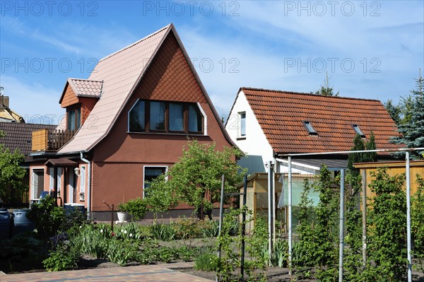 Newly built detached house in a suburban neighbourhood in Germany. Newly build residential in a in a suburban neighbourhood in Germany