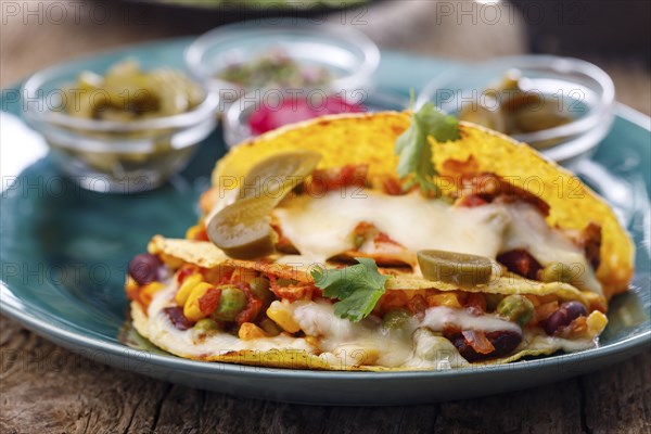 Mexican tacos baked with cheese