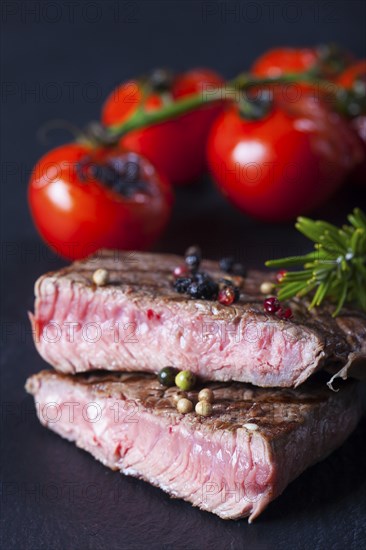 Juicy cut steak on a slate plate