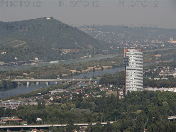 City panorama with modern skyscraper and several rivers crossing the landscape, Vienna, Austria, Europe